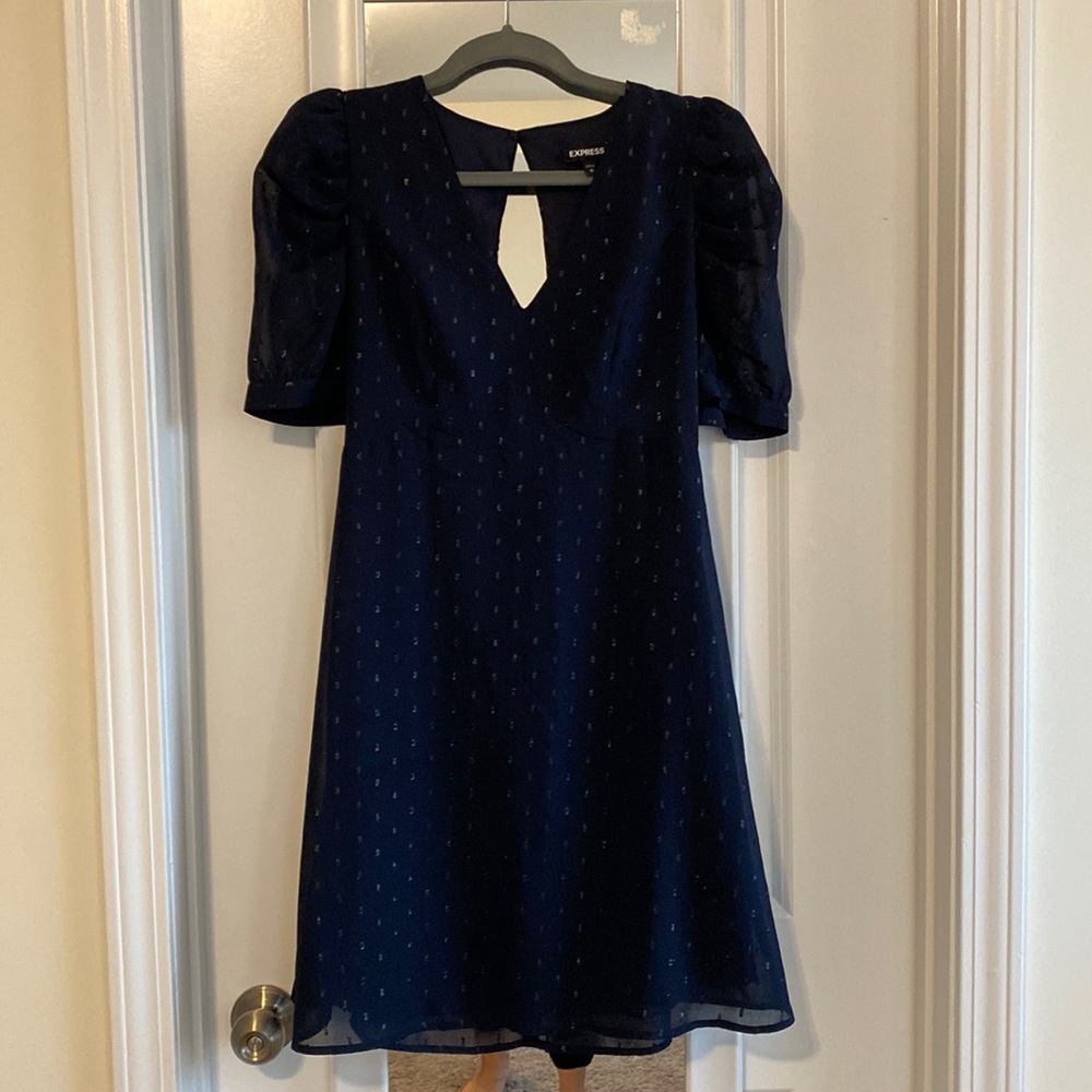 Dark blue dress, beautiful and looking good.